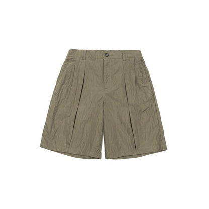 Solid color loose silhouette anti splash water pressure pleated suit shorts for men